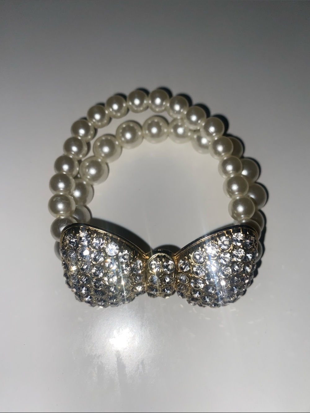 Pearl Tone Beaded Bracelet with Crystal Bow Accent